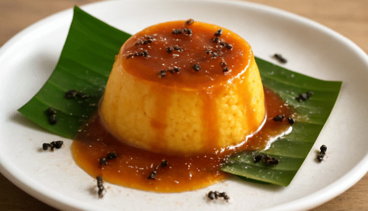 Pudim de mandioca com cajá, castanha, calda de formiga e creme de caramelo, decorado com folha de bananeira e formigas.